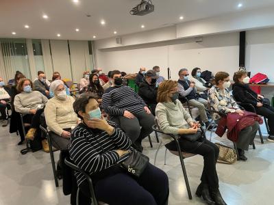 SOCIOS ASISTIENDO A LA PONENCIA DEL DIA INTERNACIONAL DE LA MUJER