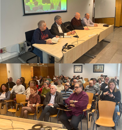 Foto durante la presentación con vistas de la mesa y la sala